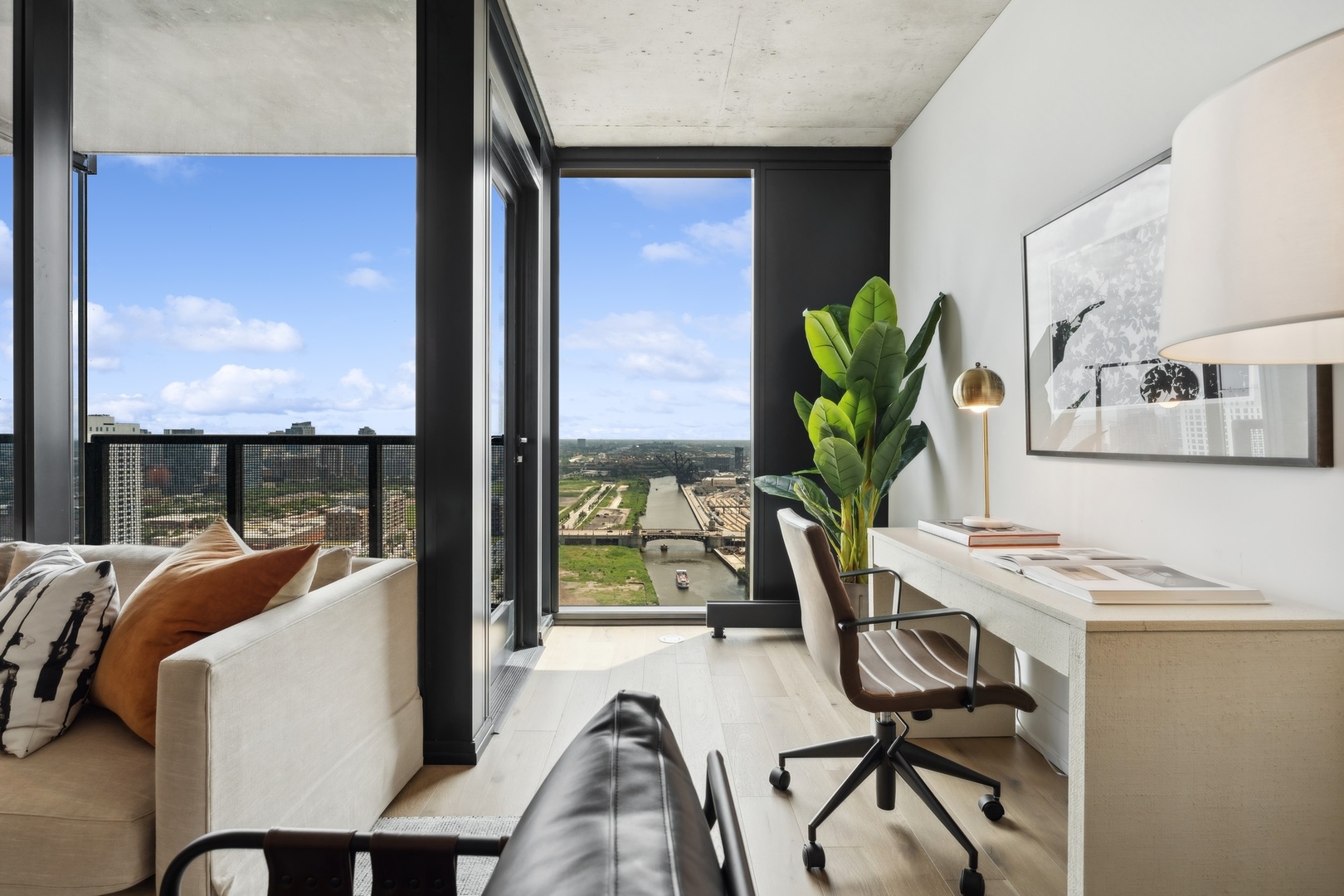 234 West Polk Street, Unit 2905 Chicago, IL 60607 - Photo 12 of 36 a view of a workspace with furniture and a potted plant