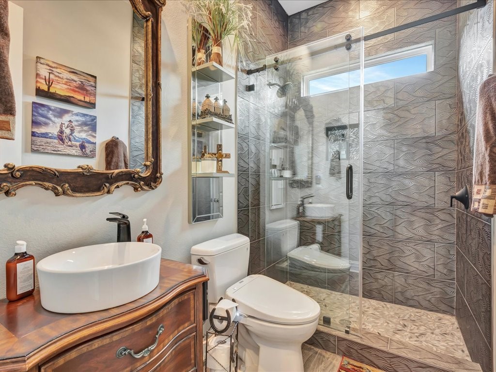 104 Wheeler Road Lufkin, TX 75901 - Photo 23 of 45 a bathroom with a sink toilet and shower