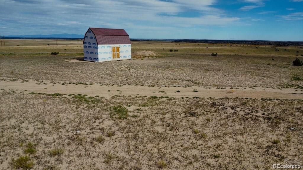 6567 Mdw Blf Drive Rye, CO 81069 - Photo 5 of 21 a view of a dry yard with wooden fence