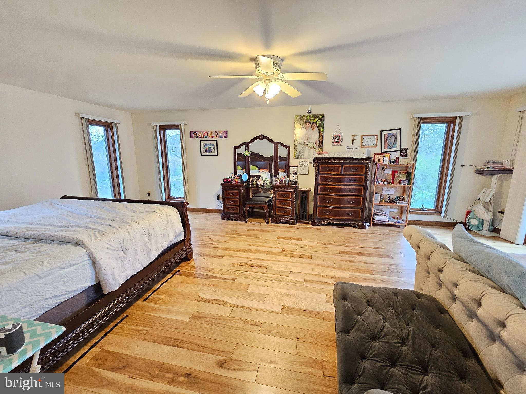 1101 Riverview Drive Reading, PA 19605 - Photo 16 of 67 a bedroom with a large bed and a chandelier