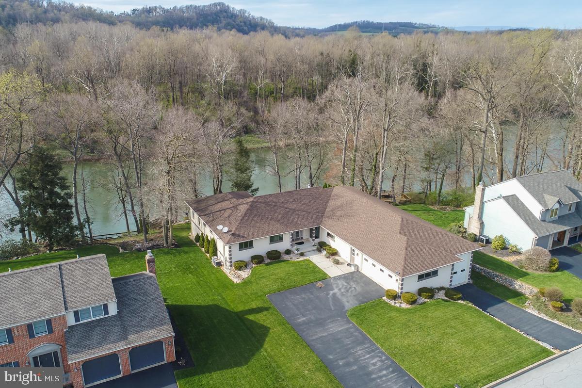 1101 Riverview Drive Reading, PA 19605 - Photo 2 of 67 an aerial view of a house with garden space and trees all around
