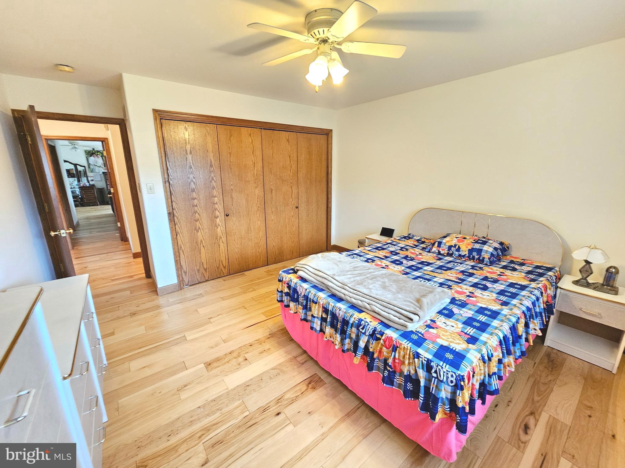 1101 Riverview Drive Reading, PA 19605 - Photo 23 of 67 a bedroom with a bed and wooden floor