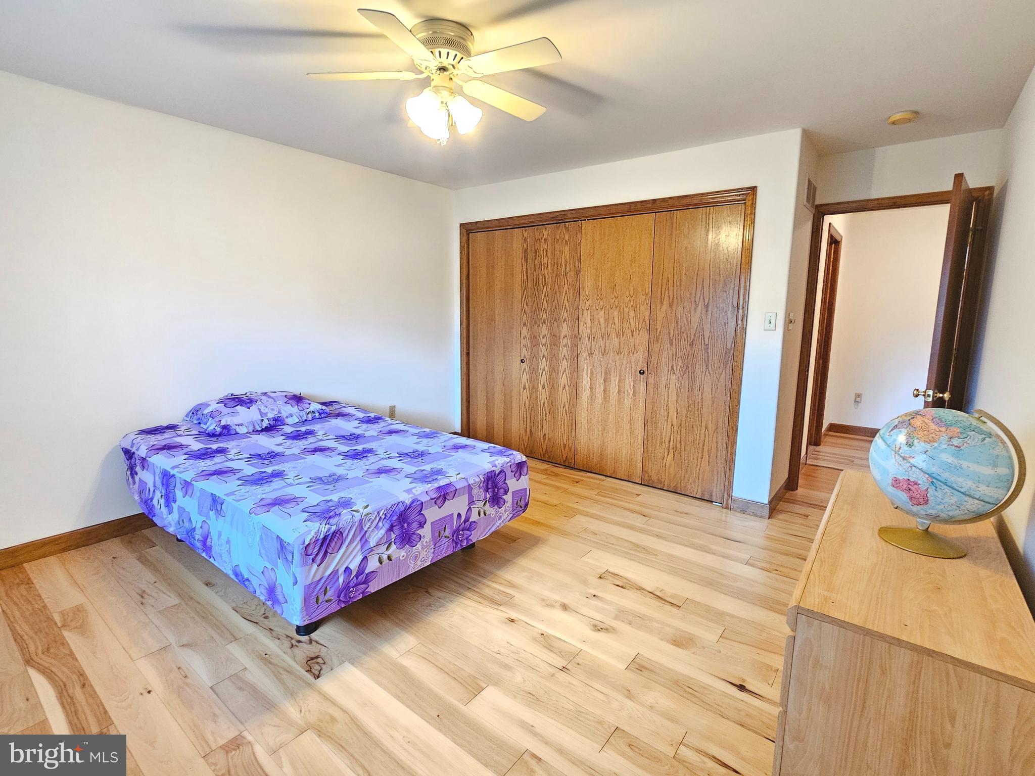 1101 Riverview Drive Reading, PA 19605 - Photo 27 of 67 a bedroom with a bed and a chandelier