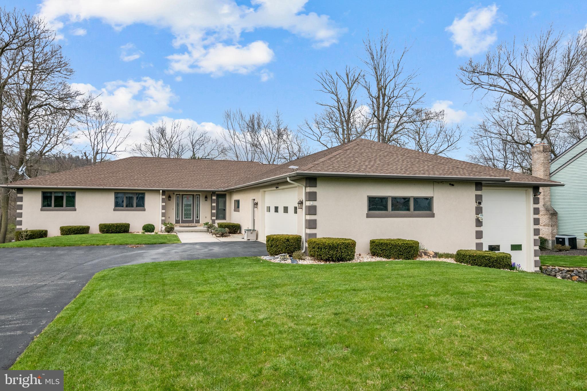 1101 Riverview Drive Reading, PA 19605 - Photo 65 of 67 a front view of a house with a yard and trees