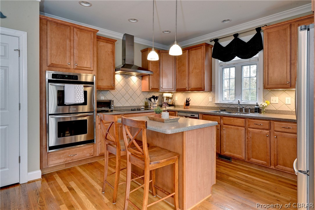 3165 Ridge Drive Toano, VA 23168 - Photo 11 of 41 Spacious kitchen offers a center island that is the perfect prep area, double ovens, smooth top cooktop, pantry, tiled backsplash, and eat-in breakfast area.