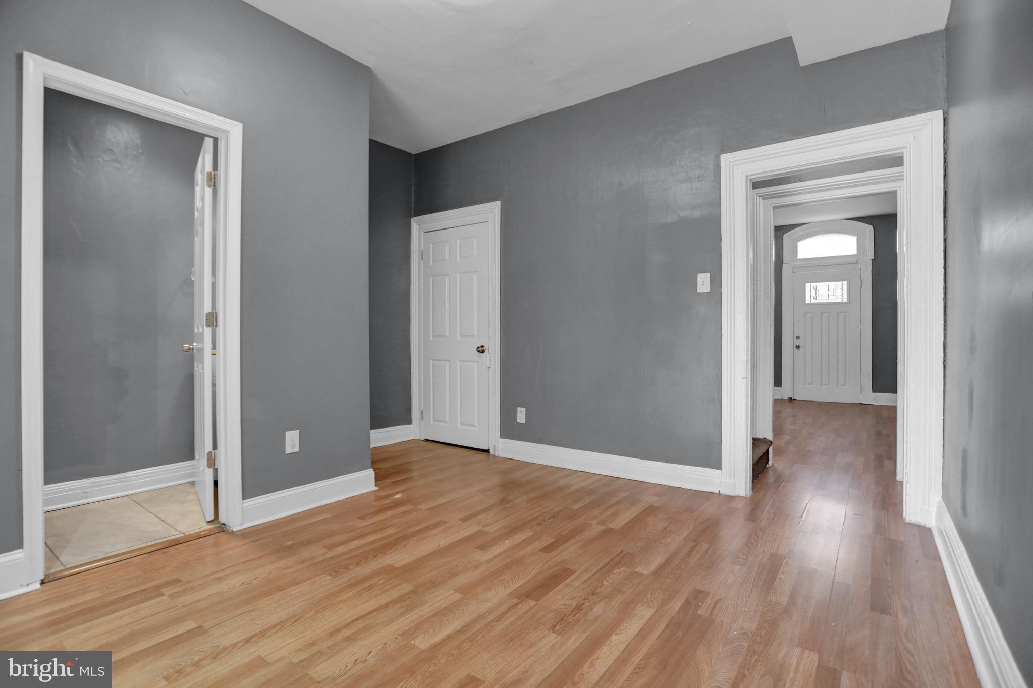 957 Bennett Place Baltimore, MD 21223 - Photo 11 of 30 an empty room with wooden floor and closet