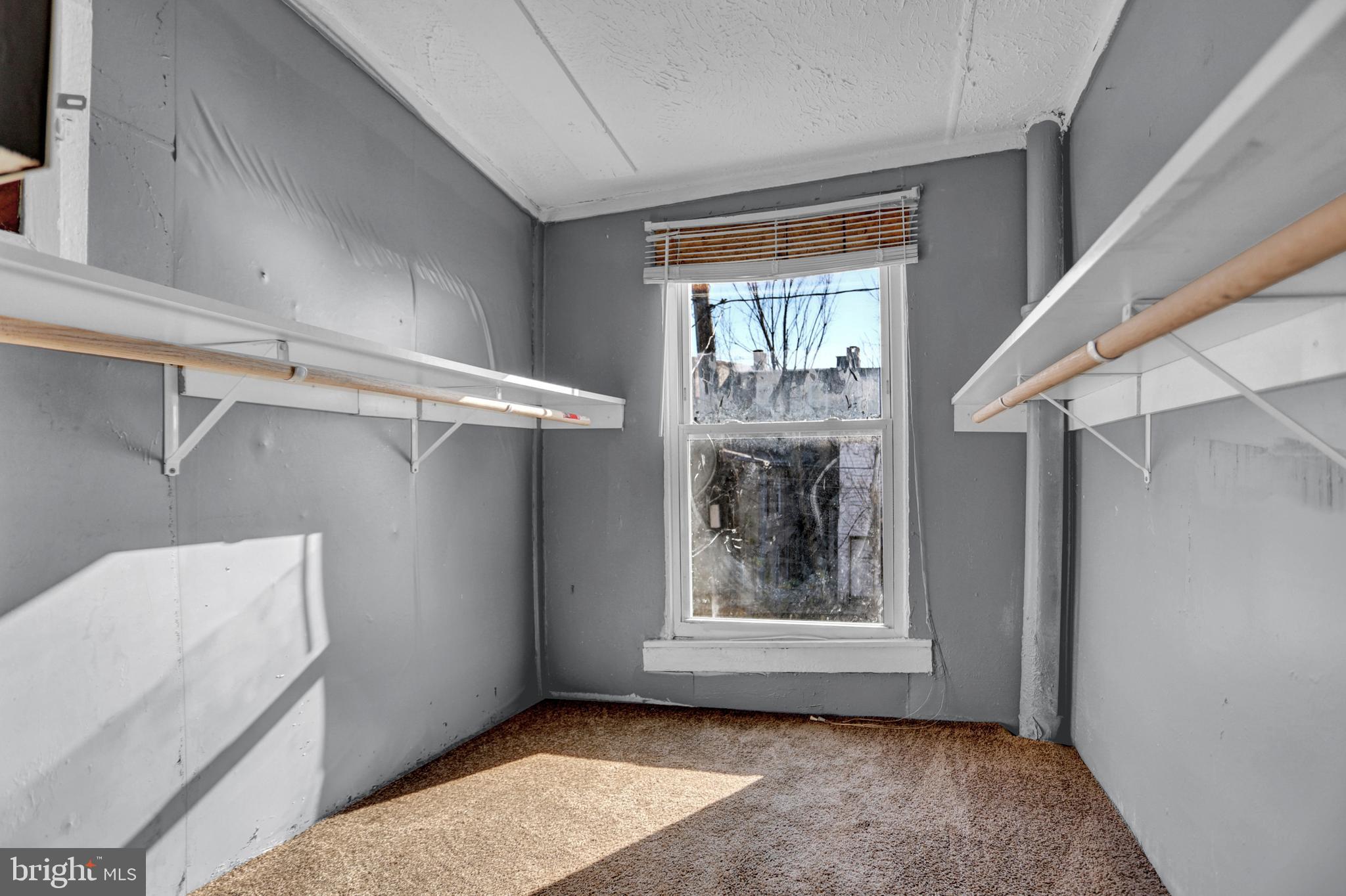 957 Bennett Place Baltimore, MD 21223 - Photo 21 of 30 a view of an empty room with a window