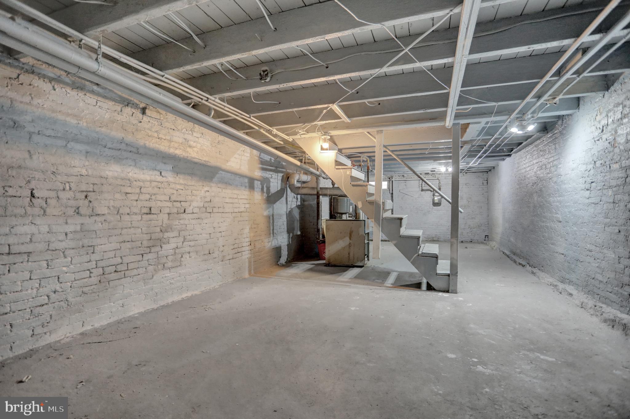 957 Bennett Place Baltimore, MD 21223 - Photo 24 of 30 a view of empty room with wooden floor