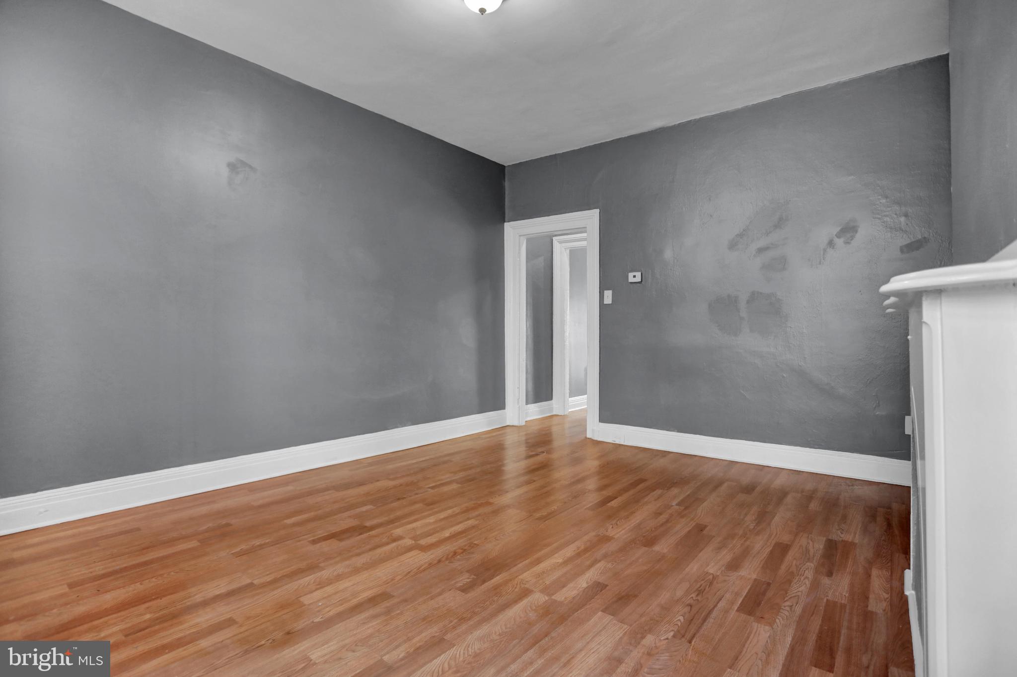 957 Bennett Place Baltimore, MD 21223 - Photo 10 of 30 a view of an empty room with wooden floor