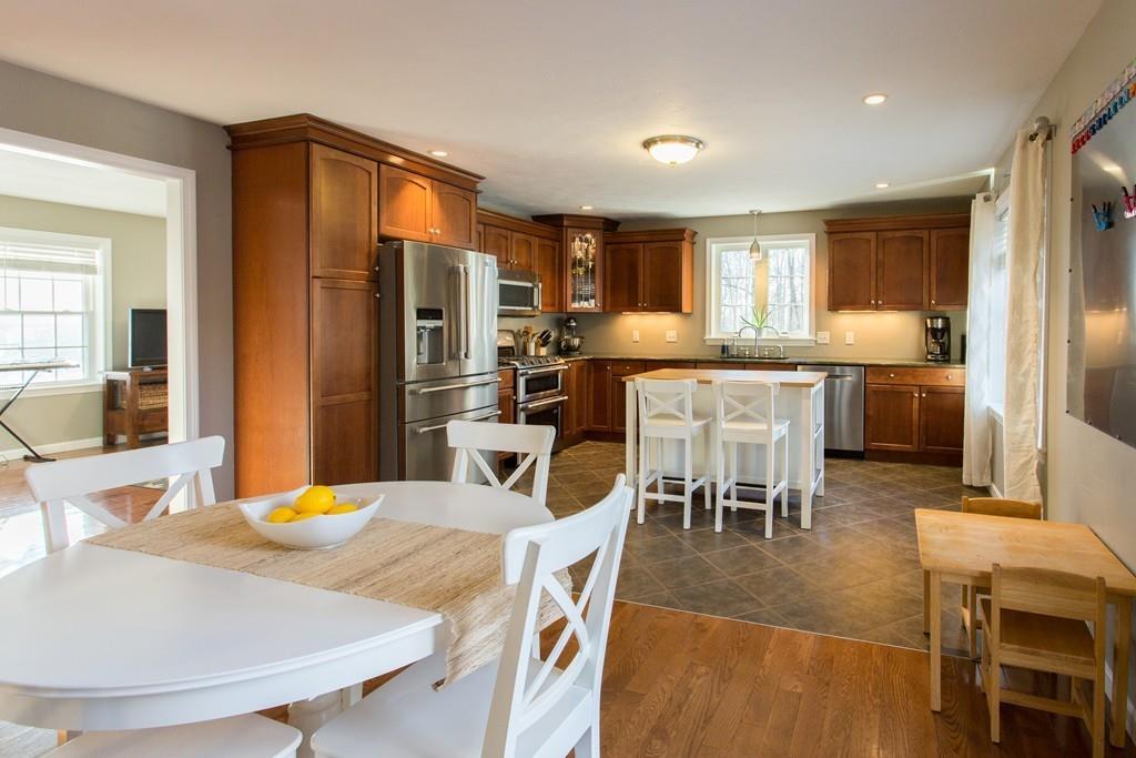 75 Ragged Hill Road West Brookfield, MA 01585 - Photo 3 of 38 a kitchen with stainless steel appliances kitchen island granite countertop a dining table chairs and granite counter tops