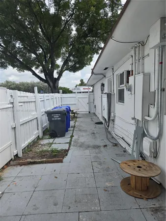 a view of a patio with chair and tables