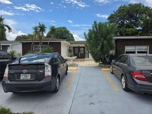 a car parked in front of a house