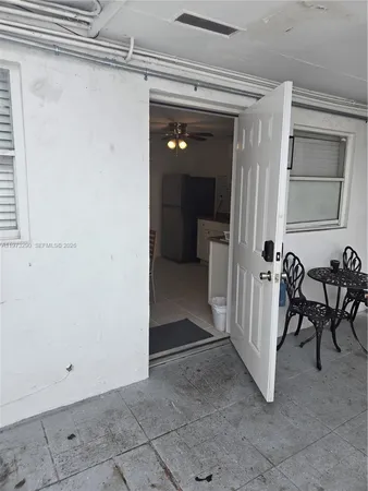 a view of a hallway to rooms