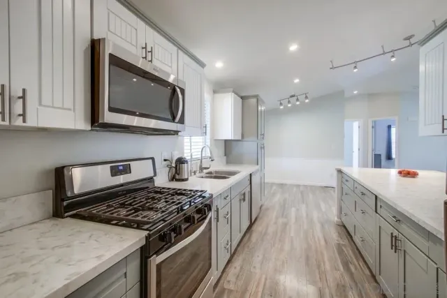a kitchen with a stove and a microwave