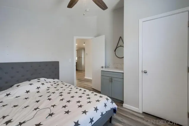 a bedroom with a bed and cabinets