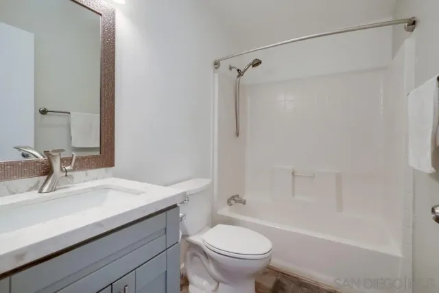 a bathroom with a sink a toilet and a bathtub