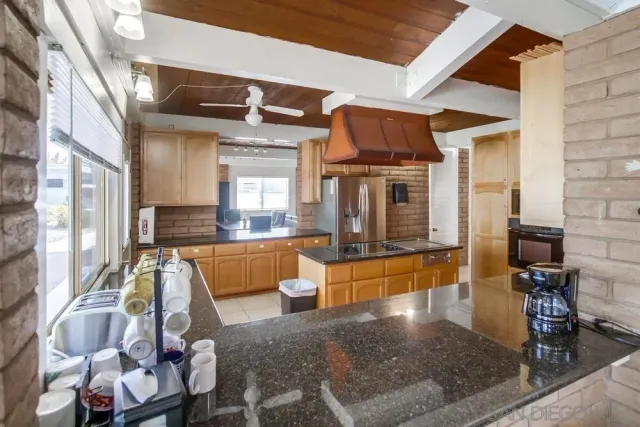 a view of living room kitchen and entryway