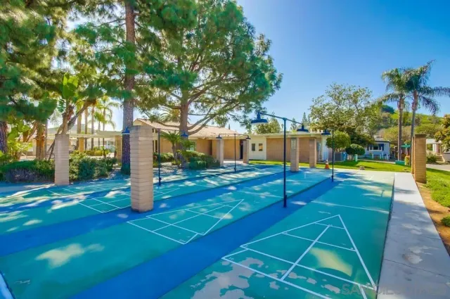 a view of a backyard with swimming pool