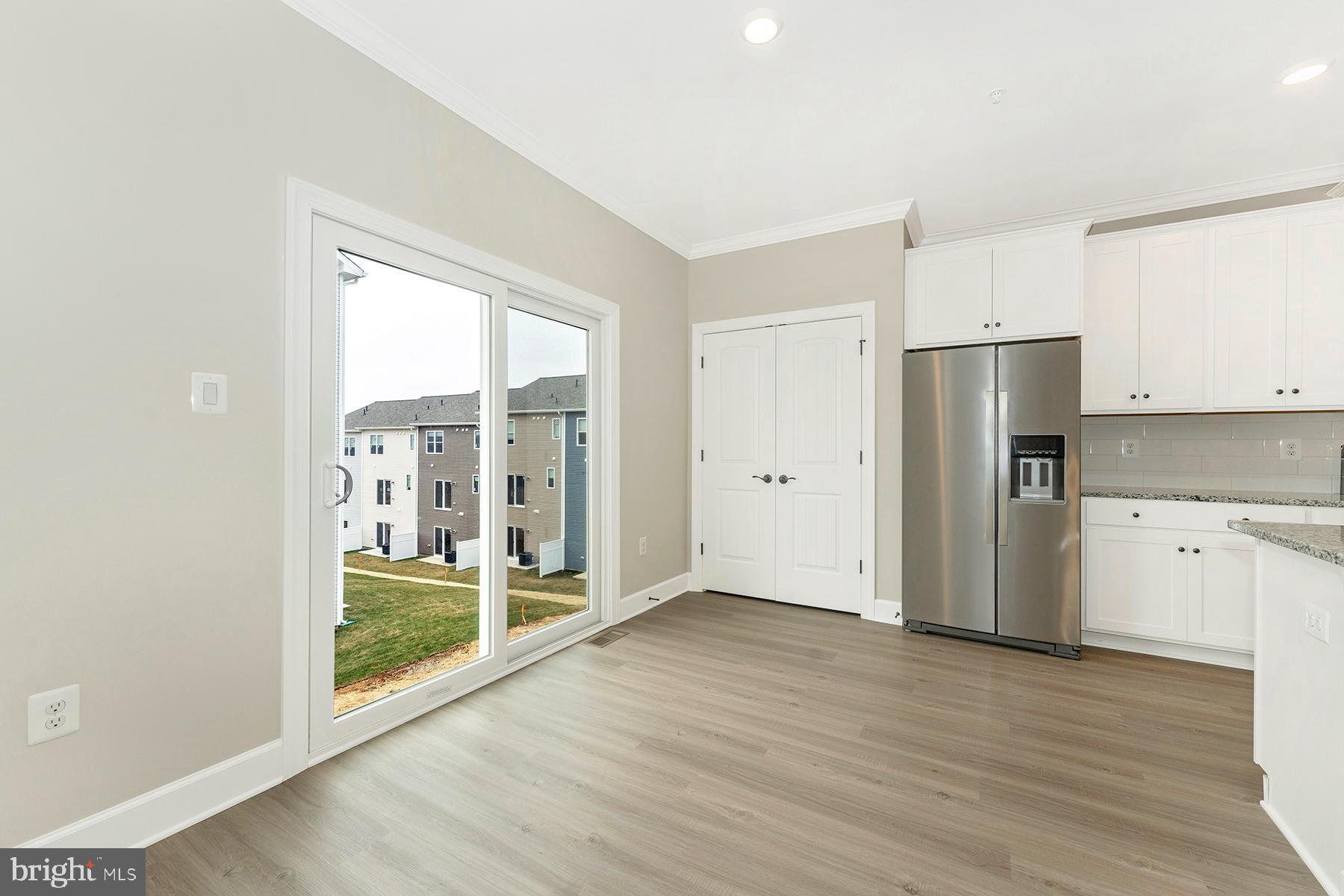 511 Iverson Road Waynesboro, PA 17268 - Photo 18 of 26 a view of kitchen with refrigerator wooden floor and window