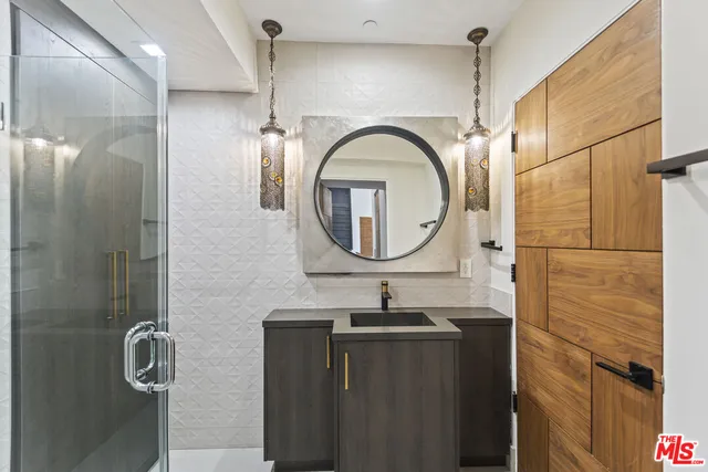 a view of a patio with furniture and a garden