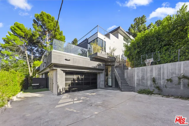 a view of a garden and basketball court
