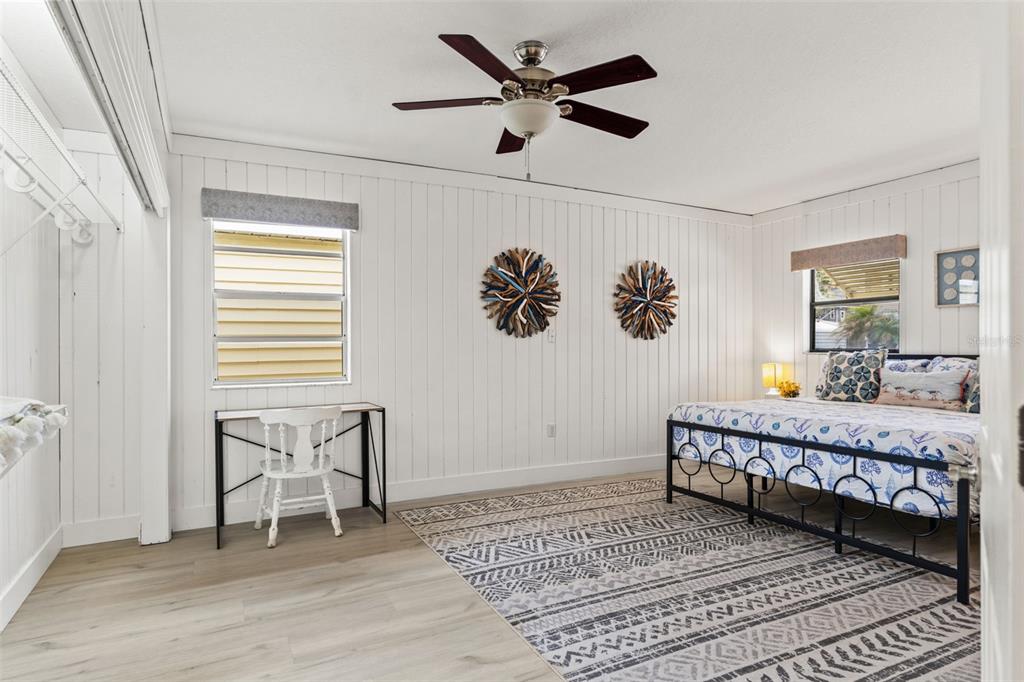 5430 Circle Drive Weeki Wachee, FL 34607 - Photo 11 of 31 a bed room with a bed and a chair