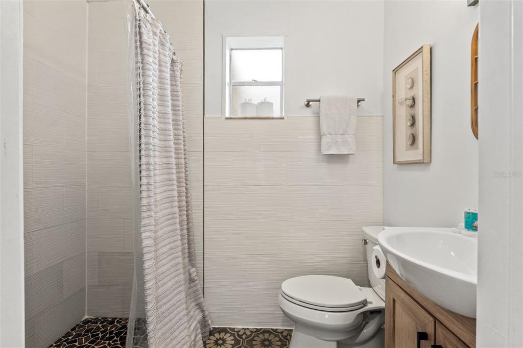 5430 Circle Drive Weeki Wachee, FL 34607 - Photo 14 of 31 a bathroom with a toilet and a sink