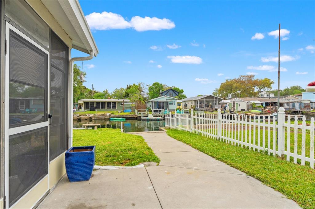5430 Circle Drive Weeki Wachee, FL 34607 - Photo 21 of 31 a view of a patio with a chairs