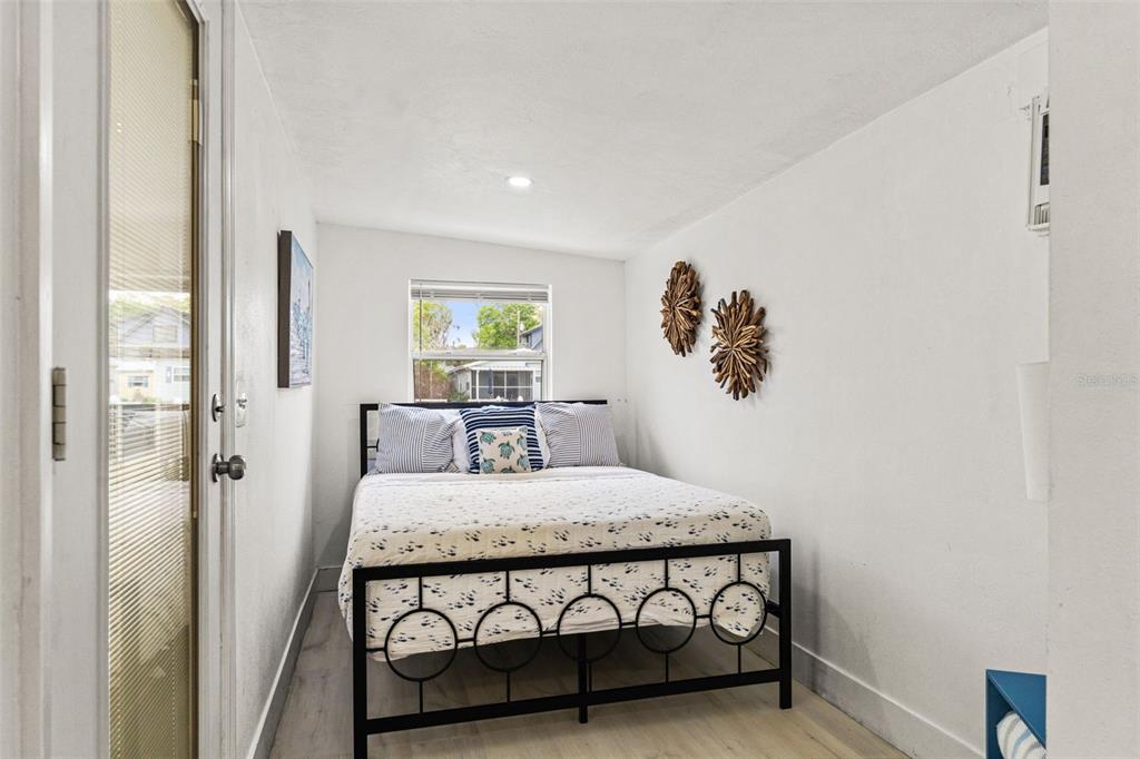 5430 Circle Drive Weeki Wachee, FL 34607 - Photo 22 of 31 a bedroom with a bed and a table in it