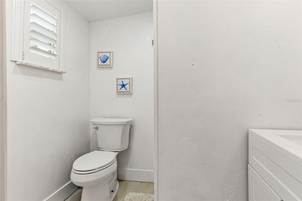 5430 Circle Drive Weeki Wachee, FL 34607 - Photo 24 of 31 a white toilet sitting next to a white cabinet