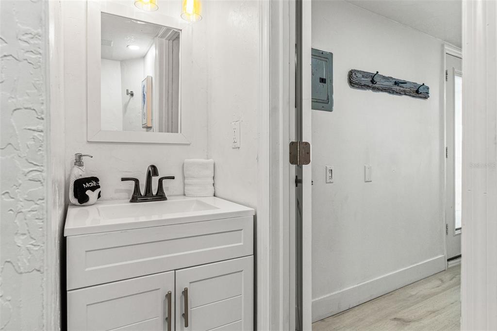 5430 Circle Drive Weeki Wachee, FL 34607 - Photo 25 of 31 a bathroom with a sink and a mirror