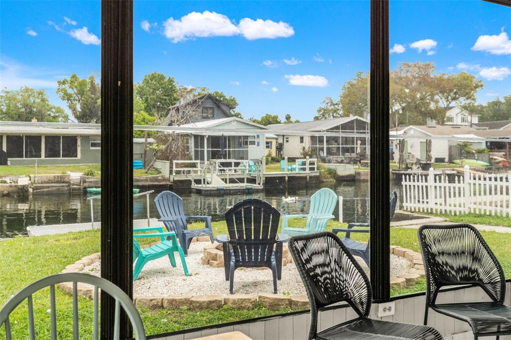 5430 Circle Drive Weeki Wachee, FL 34607 - Photo 28 of 31 a view of a patio with table and chairs
