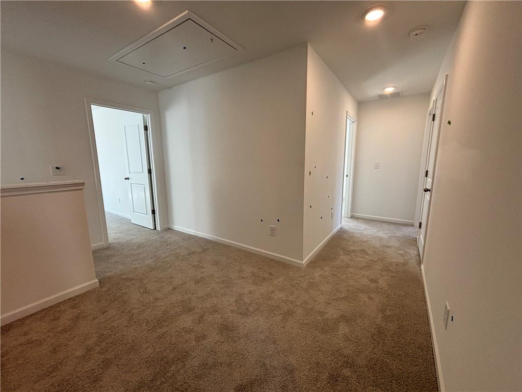 6125 Kismet Road Buford, GA 30518 - Photo 16 of 40 a view of hallway with a bathroom