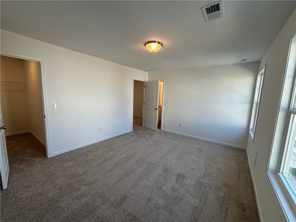 6125 Kismet Road Buford, GA 30518 - Photo 26 of 40 an empty room with windows