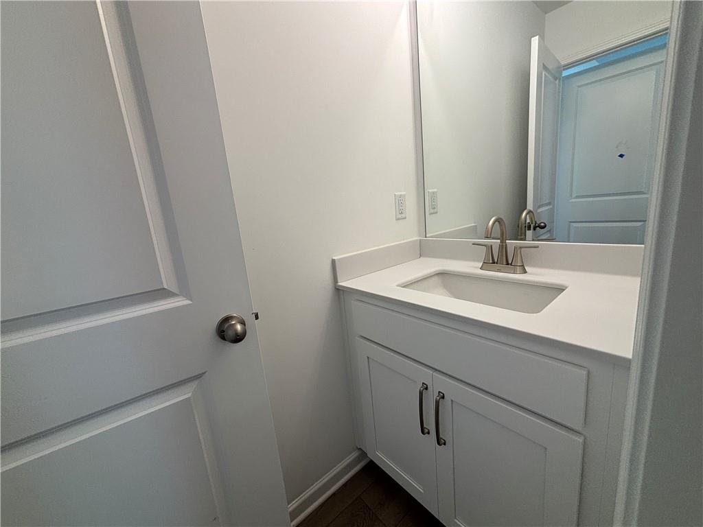 6125 Kismet Road Buford, GA 30518 - Photo 27 of 40 a bathroom with a sink and mirror