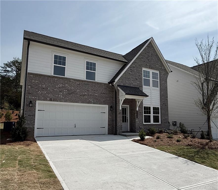 6125 Kismet Road Buford, GA 30518 - Photo 3 of 40 a front view of a house with a yard