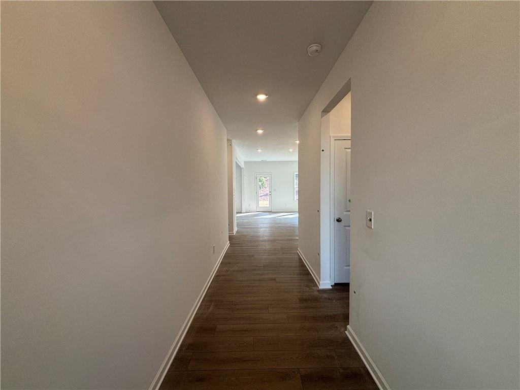 6125 Kismet Road Buford, GA 30518 - Photo 4 of 40 a view of a hallway with wooden floor