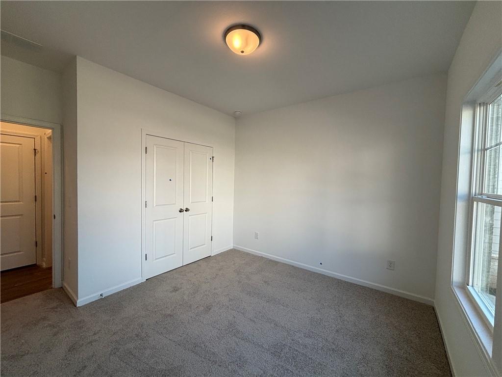 6125 Kismet Road Buford, GA 30518 - Photo 5 of 40 an empty room with a window