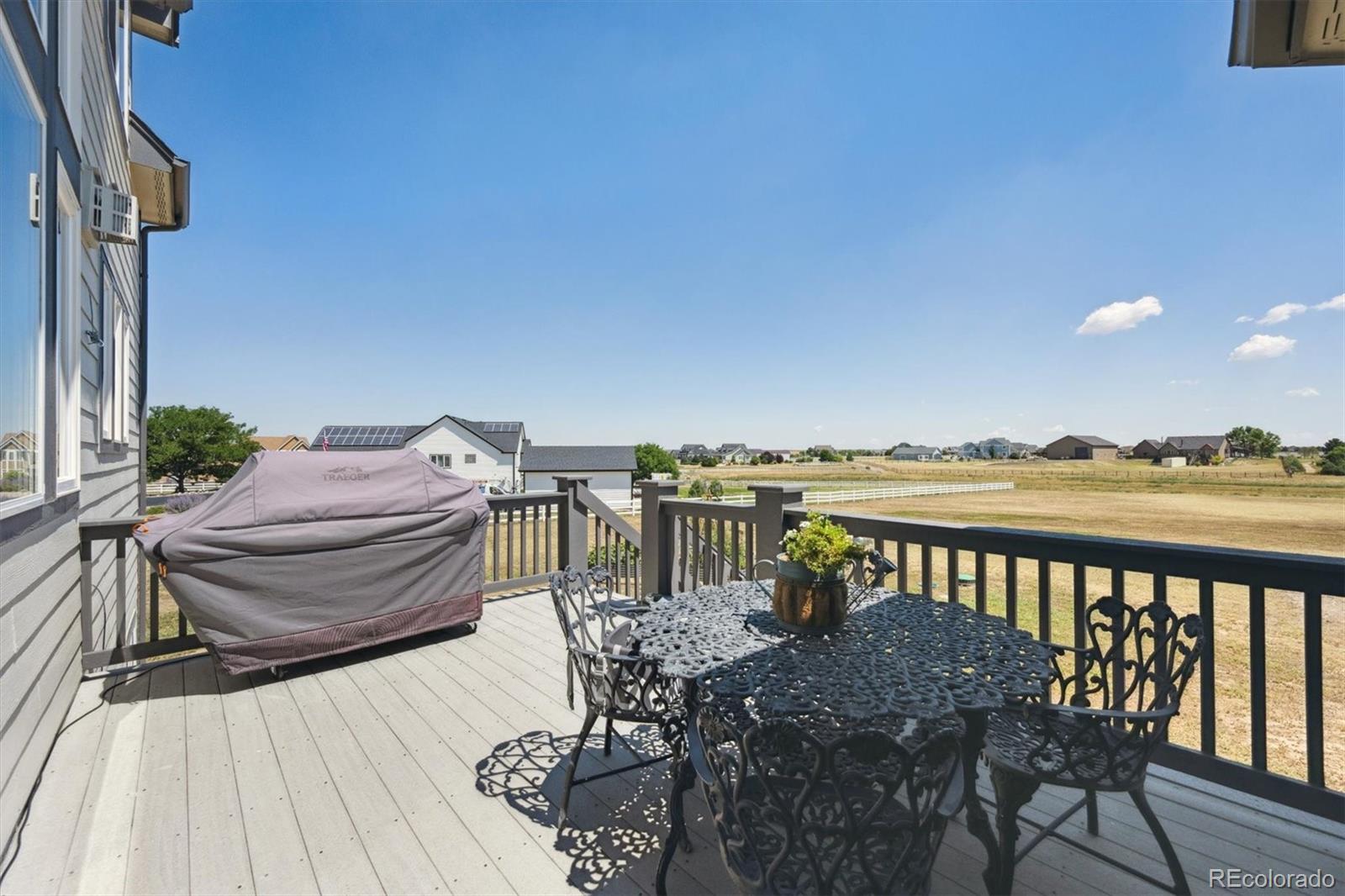 724 Imboden Road Watkins, CO 80137 - Photo 35 of 50 a view of a balcony with furniture