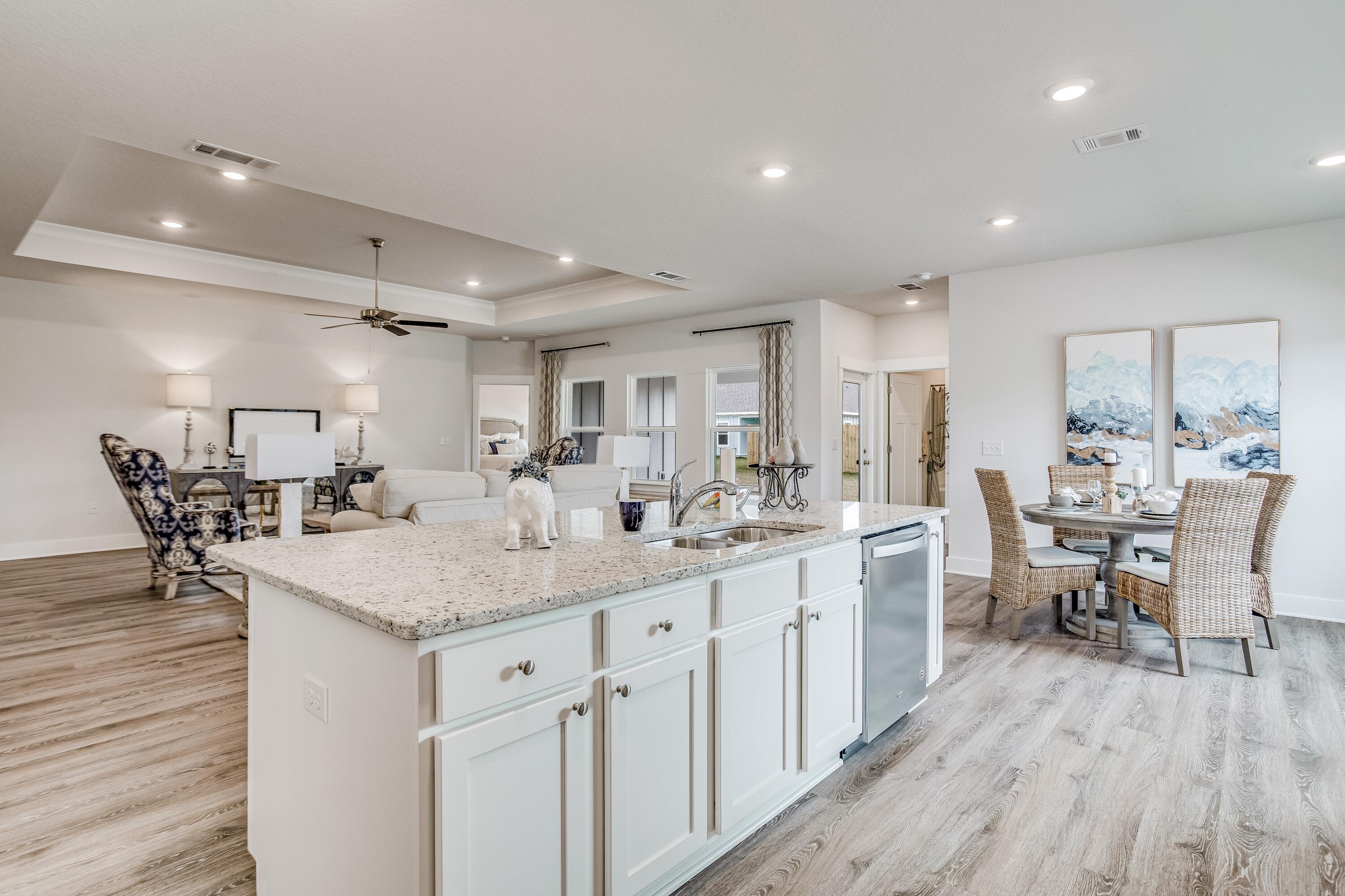 704 Quintana Street Crestview, FL 32539 - Photo 7 of 32 a kitchen with sink and cabinets