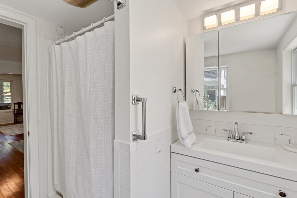 34 Eustis Street Saugus, MA 01906 - Photo 11 of 28 a bathroom with a sink and a mirror