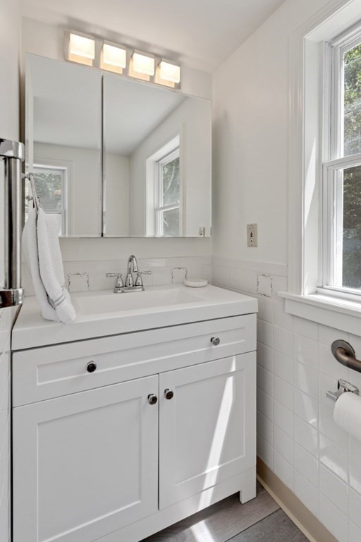 34 Eustis Street Saugus, MA 01906 - Photo 12 of 28 a bathroom with a sink and a mirror