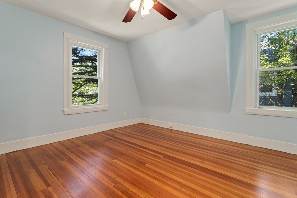 34 Eustis Street Saugus, MA 01906 - Photo 14 of 28 wooden floor in an empty room with a window