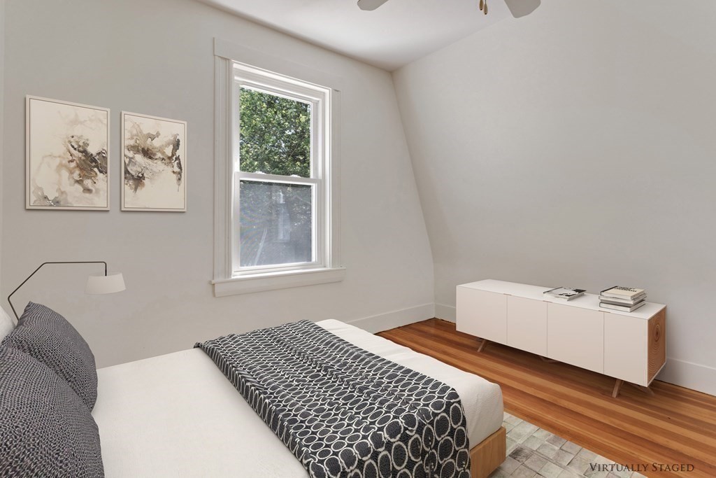 34 Eustis Street Saugus, MA 01906 - Photo 18 of 28 a bedroom with a bed and a window