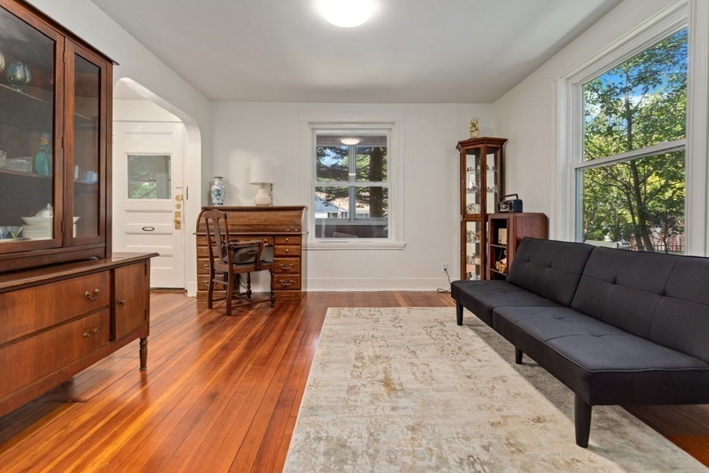 34 Eustis Street Saugus, MA 01906 - Photo 2 of 28 a living room with furniture and a fireplace