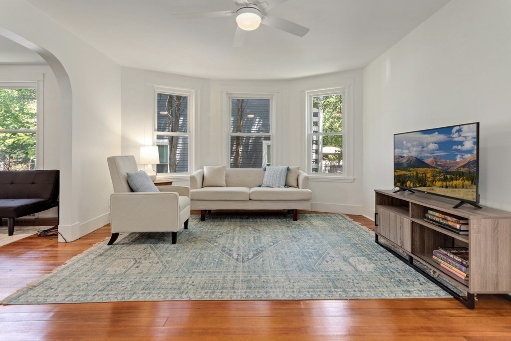 34 Eustis Street Saugus, MA 01906 - Photo 3 of 28 a living room with furniture and a flat screen tv