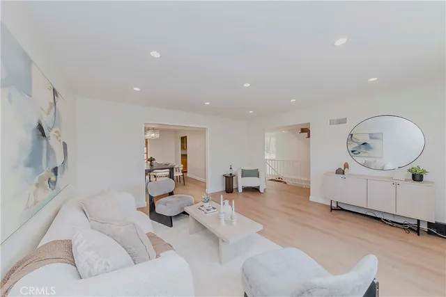 a view of a livingroom with furniture and a potted plant