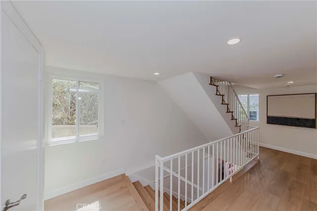 a view of entryway with wooden floor