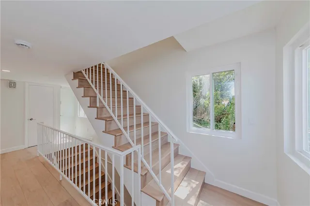 a view of a swimming pool with a lounge chair