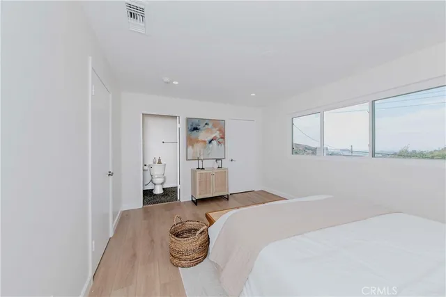 a room with a bed and a window